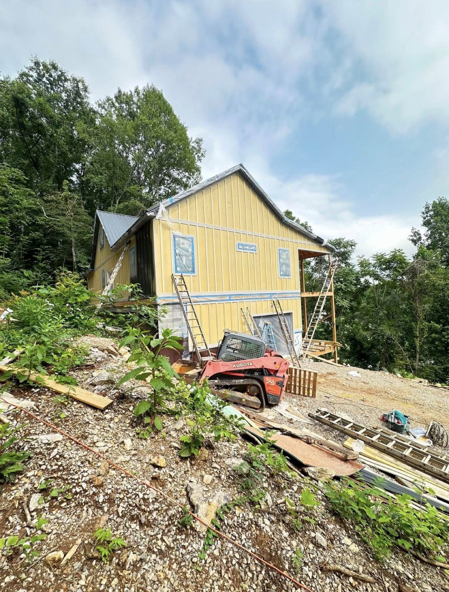 Board-and-batten house under construction before paint