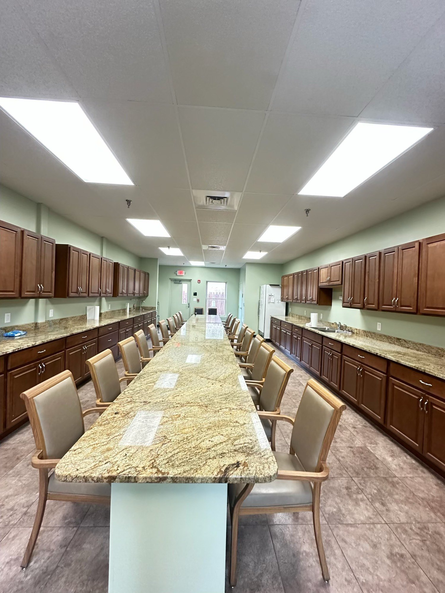 Finished commercial kitchen with granite island
